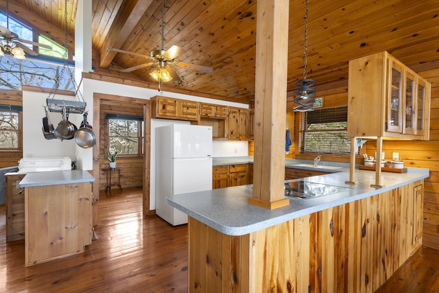 kitchen with a peninsula, dark wood-style flooring, freestanding refrigerator, wooden ceiling, and black electric stovetop