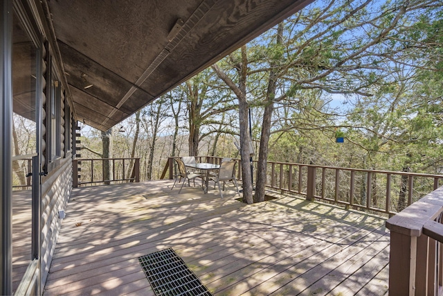 deck with outdoor dining area