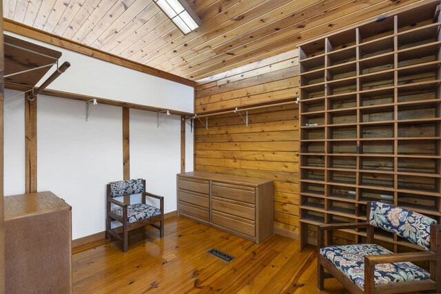 spacious closet with hardwood / wood-style flooring