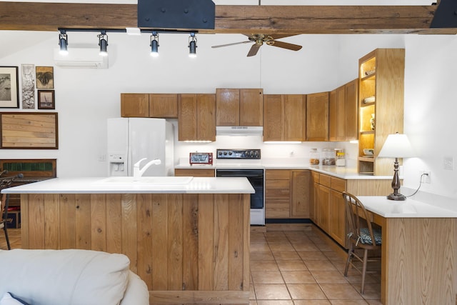 kitchen with light tile patterned floors, electric range, light countertops, white refrigerator with ice dispenser, and under cabinet range hood