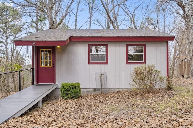 view of outdoor structure with an outbuilding and fence