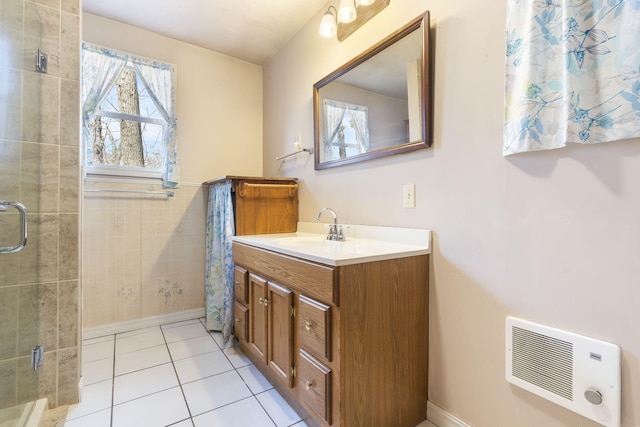 bathroom featuring tile patterned floors, visible vents, a stall shower, and vanity