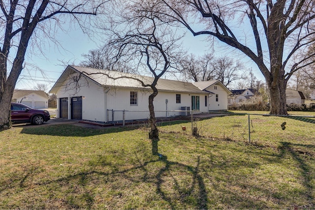 view of front of property with a front yard, fence, and metal roof