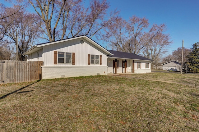 ranch-style home with crawl space, brick siding, a front lawn, and fence