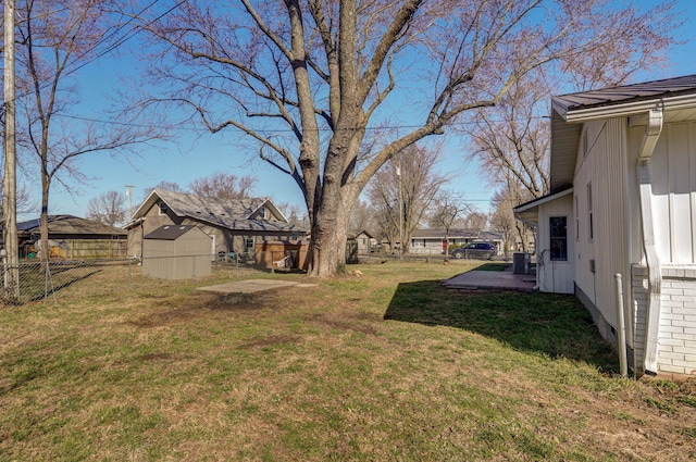 view of yard featuring cooling unit and fence