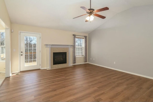 175 Mesquite Dr, Branson, MO 65616 - unfurnished living room with a ceiling fan, wood finished floors, a healthy amount of sunlight, and lofted ceiling