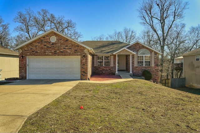 single story home featuring brick siding, an attached garage, concrete driveway, and a front yard