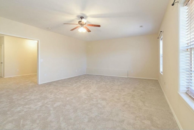 175 Mesquite Dr, Branson, MO 65616 - unfurnished room featuring baseboards, carpet, a healthy amount of sunlight, and a ceiling fan