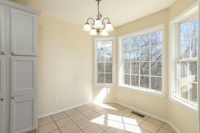 175 Mesquite Dr, Branson, MO 65616 - unfurnished dining area featuring light tile patterned floors, visible vents, an inviting chandelier, and baseboards