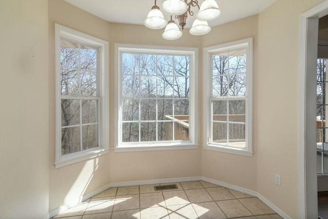 175 Mesquite Dr, Branson, MO 65616 - unfurnished dining area with tile patterned flooring, visible vents, a chandelier, and baseboards