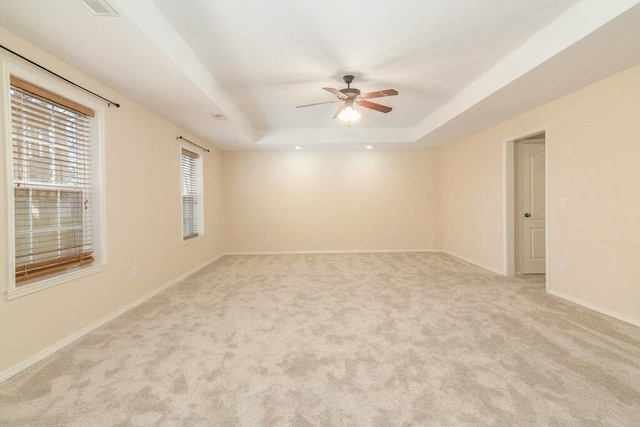 175 Mesquite Dr, Branson, MO 65616 - spare room with light carpet, ceiling fan, baseboards, and a tray ceiling