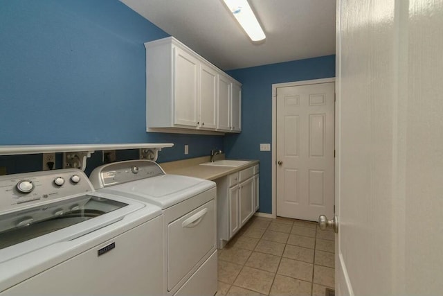 175 Mesquite Dr, Branson, MO 65616 - washroom with cabinet space, light tile patterned floors, washing machine and dryer, and a sink