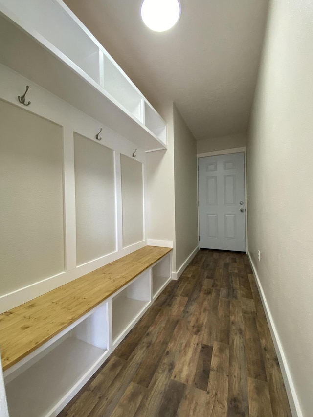 mudroom featuring baseboards and wood finished floors