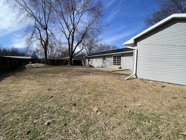 view of yard featuring a patio and fence