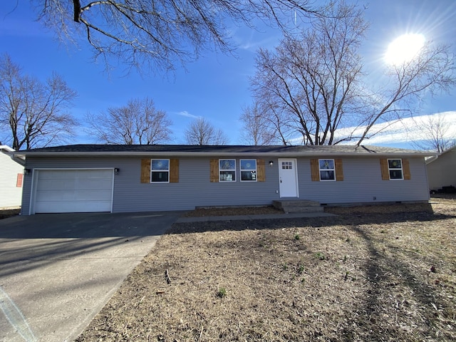 single story home with an attached garage and driveway