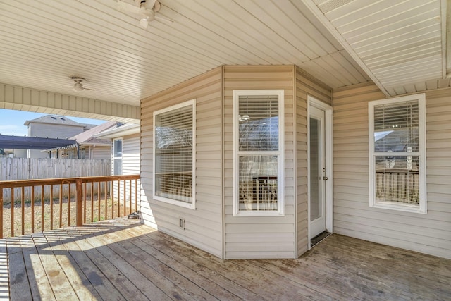 wooden terrace featuring fence