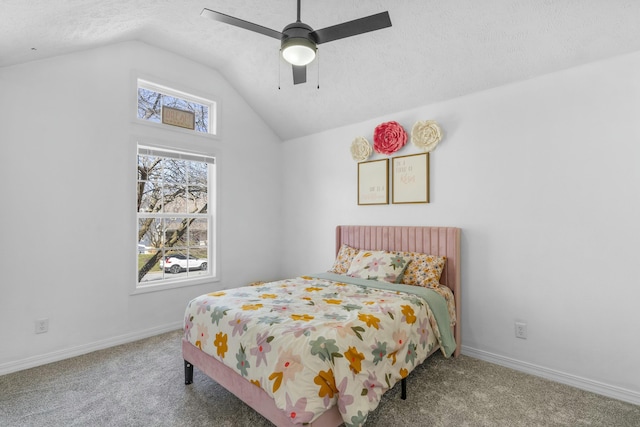 bedroom featuring lofted ceiling, carpet flooring, baseboards, and a textured ceiling