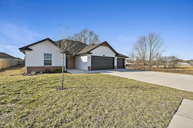 ranch-style house featuring a front yard, fence, concrete driveway, a garage, and brick siding