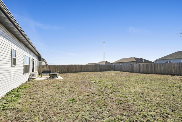 view of yard featuring a patio area and a fenced backyard