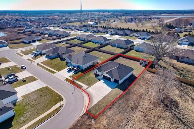 birds eye view of property with a residential view