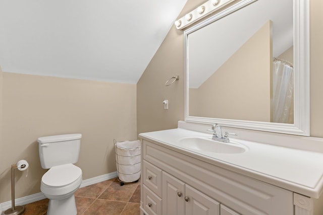 bathroom featuring baseboards, lofted ceiling, toilet, and vanity