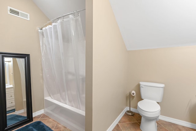 bathroom with baseboards, visible vents, vaulted ceiling, tile patterned floors, and toilet