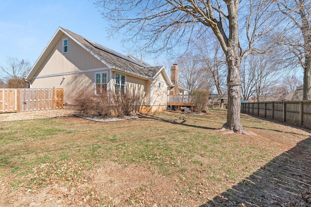 view of yard featuring a deck and a fenced backyard