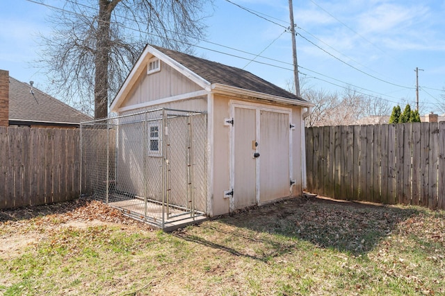 view of shed with a fenced backyard