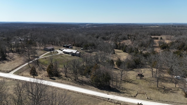 drone / aerial view with a forest view and a rural view