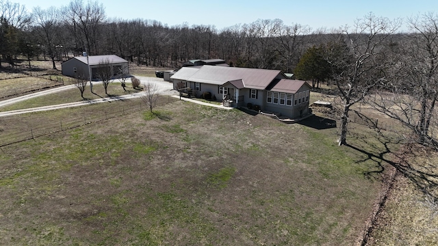 drone / aerial view featuring a forest view