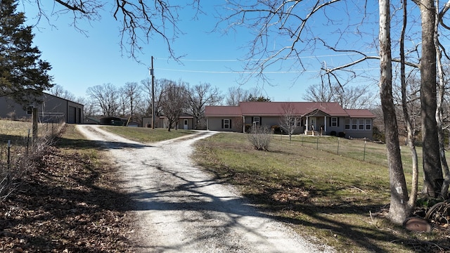 view of road featuring gravel driveway