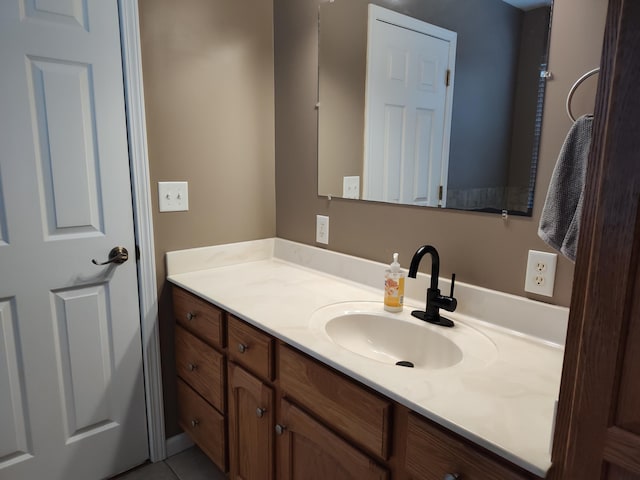 bathroom with vanity and tile patterned flooring