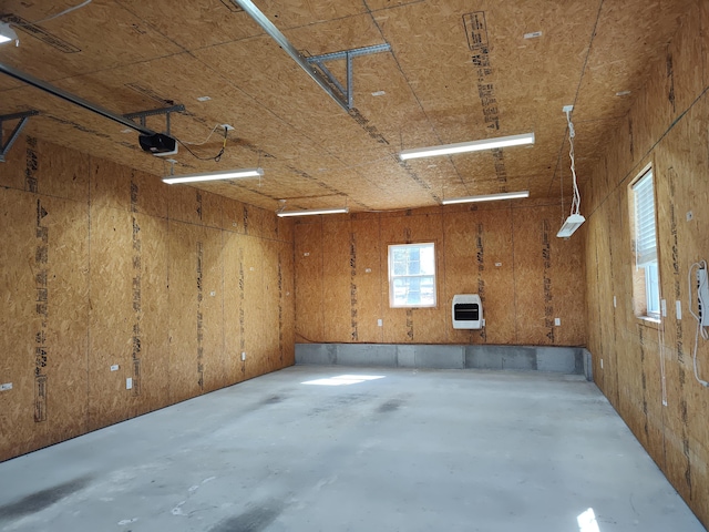 garage with heating unit and a garage door opener