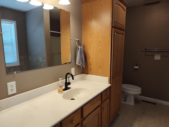 full bath with tile patterned floors, visible vents, toilet, baseboards, and vanity