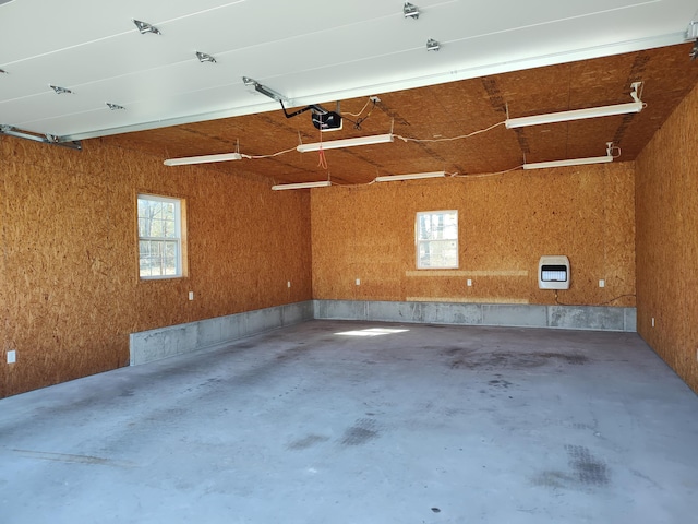 garage with heating unit and a garage door opener