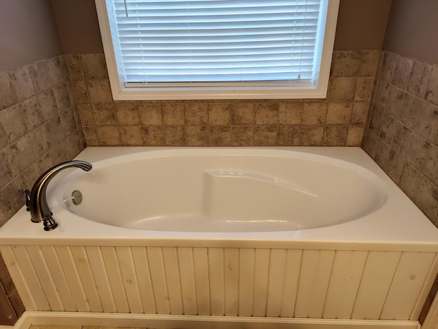 bathroom featuring a garden tub