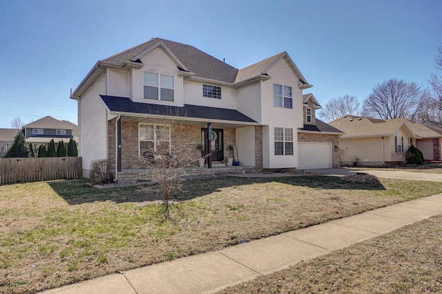 traditional home with fence, a porch, concrete driveway, a front lawn, and a garage