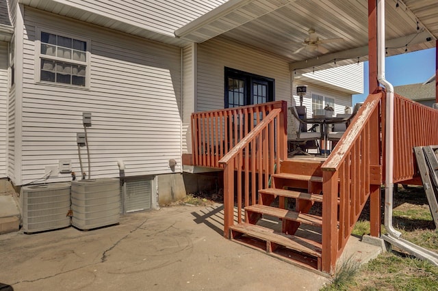 exterior space with stairway, central AC unit, a ceiling fan, and a patio area