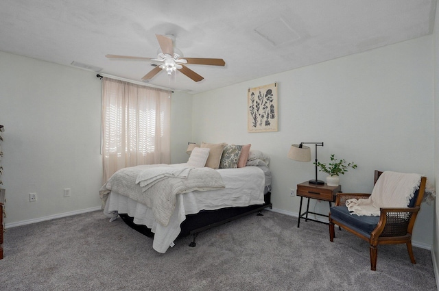 carpeted bedroom featuring a ceiling fan, baseboards, and visible vents