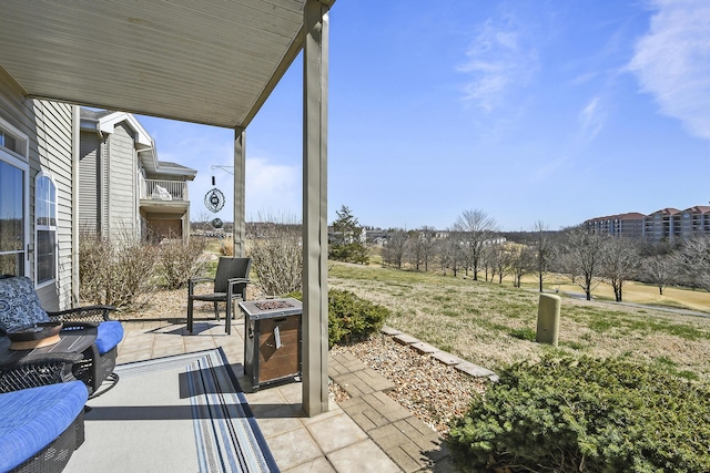 view of patio with an outdoor fire pit