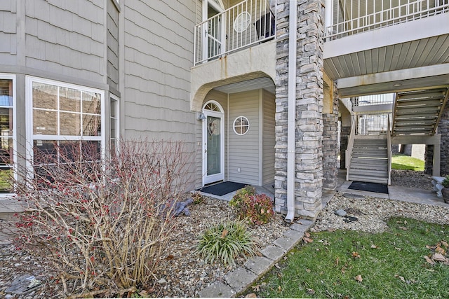 doorway to property with stone siding