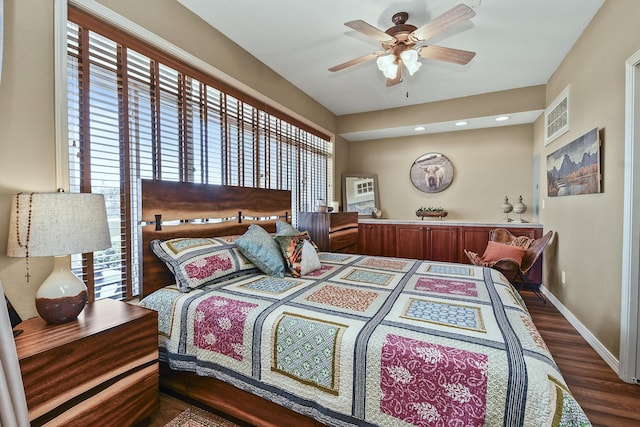 bedroom with a ceiling fan, visible vents, baseboards, dark wood finished floors, and recessed lighting