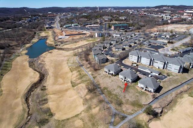 birds eye view of property featuring a residential view and a water view