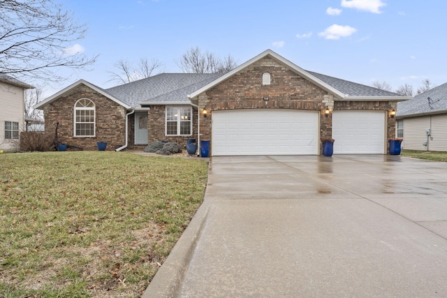 ranch-style home featuring driveway, roof with shingles, a front lawn, a garage, and brick siding