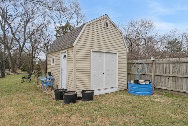 view of shed featuring fence