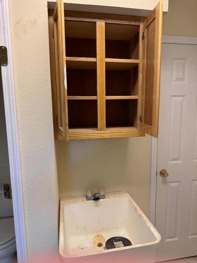 bathroom with toilet and a sink