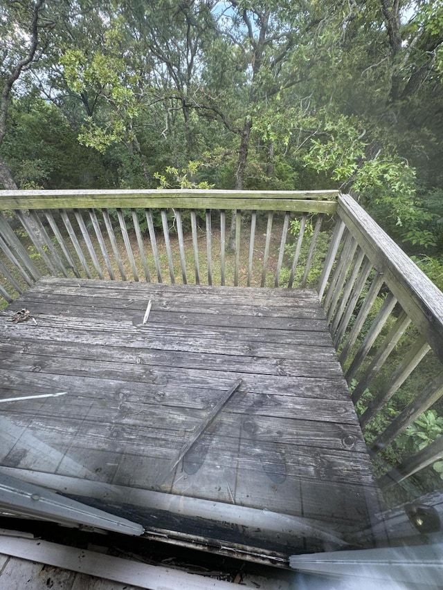 deck featuring a forest view