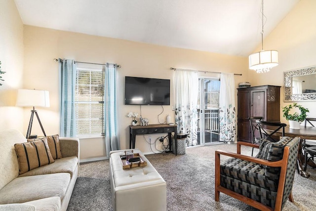 carpeted living room with lofted ceiling and a healthy amount of sunlight