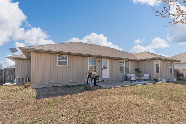 back of property featuring fence, central AC, a yard, crawl space, and a patio