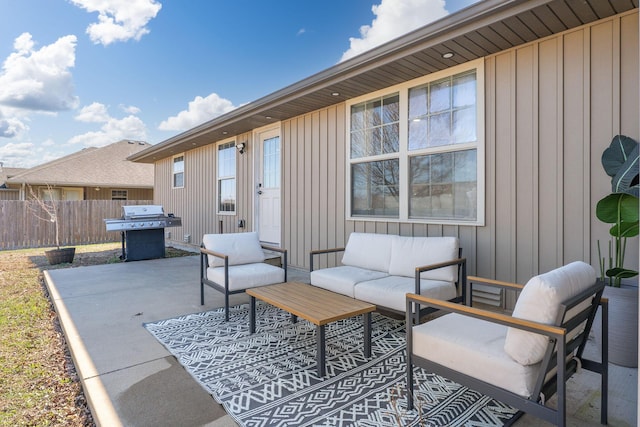 view of patio with an outdoor living space, a grill, and fence